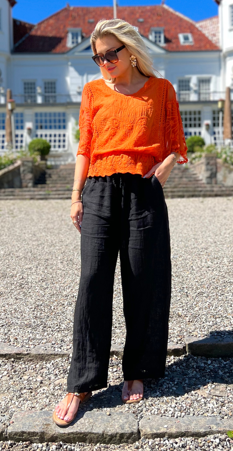 Lexi bluse med elastik i taljen og flagermusærmer orange LikeLondon