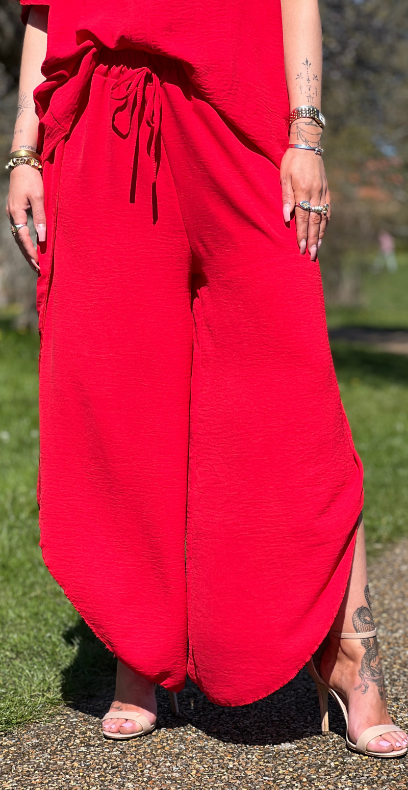 Beate bukser med åbning i siden rød LikeLondon