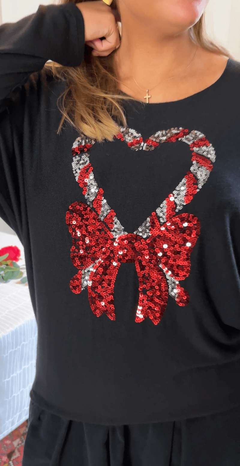 Madelene bluse med paillet sukkerstok og sløjfe sort LikeLondon