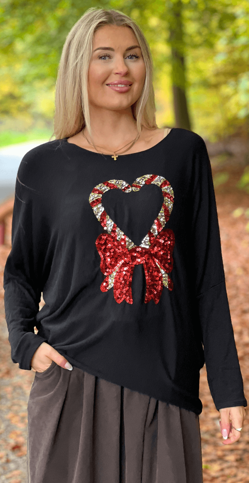 Madelene bluse med paillet sukkerstok og sløjfe sort LikeLondon