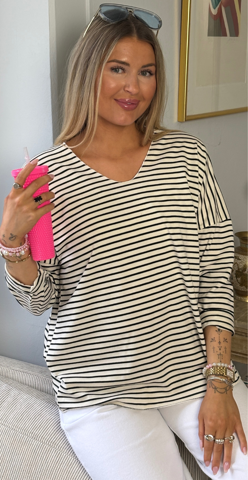 Evita bluse med v-hals og striber sort LikeLondon