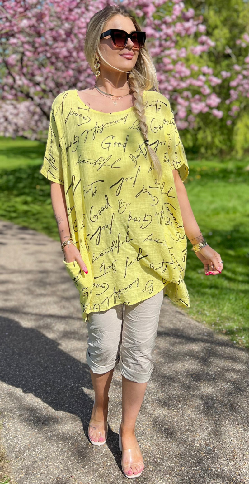 Dicte bluse med vidde, lommer og skrift gul LikeLondon